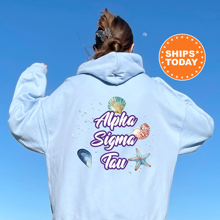 a woman with her back to the camera wearing a white hoodie