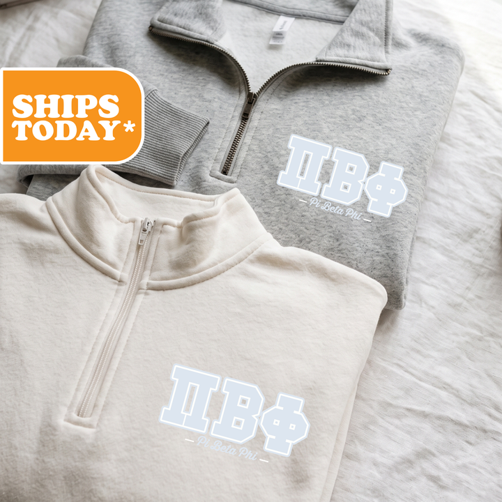Two gray and white sweatshirts with the text "IB*" printed on them, along with a "Delta Phi" logo.