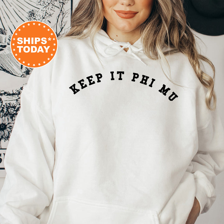 a woman wearing a white hoodie that says keep it pho