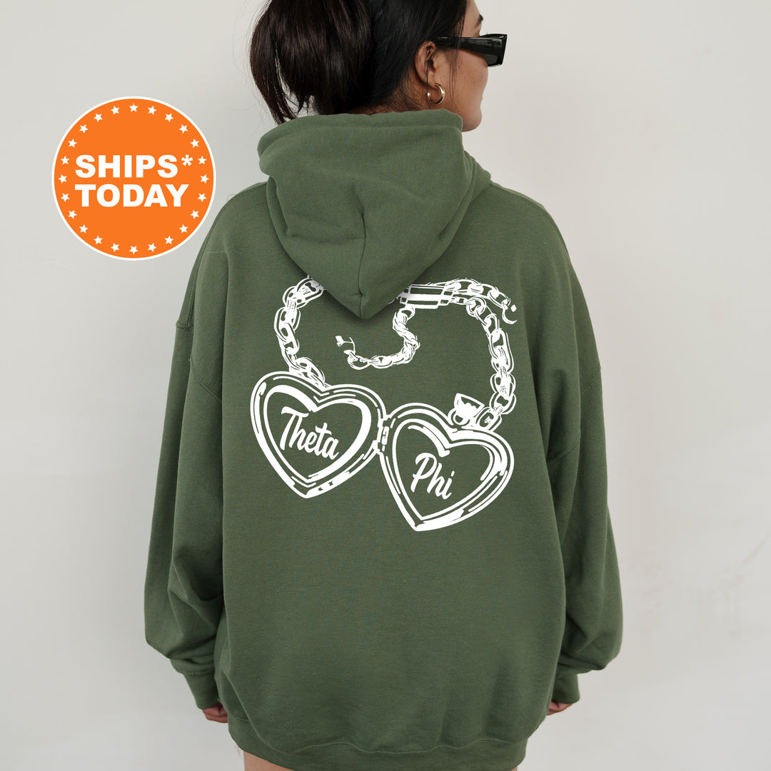 A person wearing a green hoodie with white text and graphics on the back.