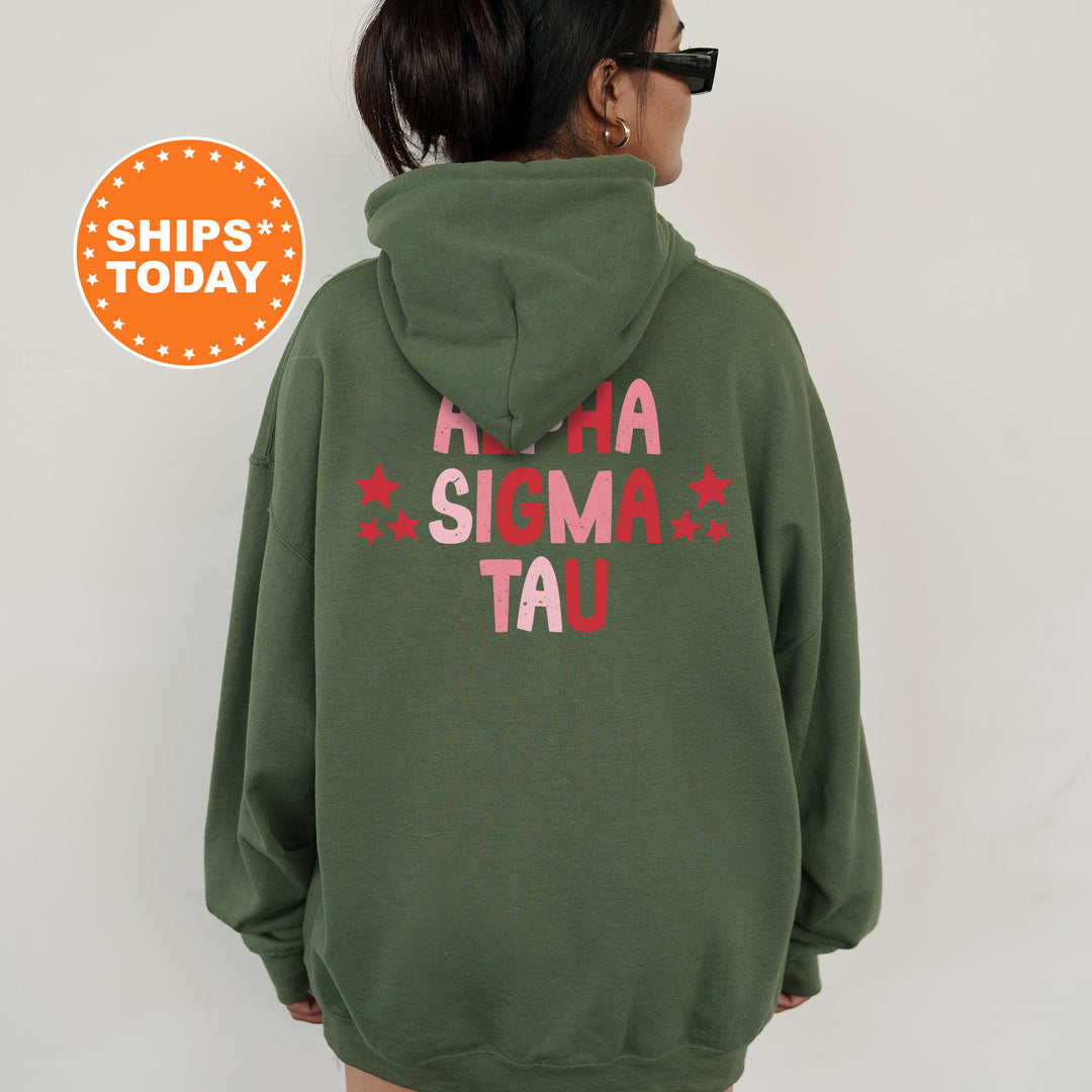 a woman wearing a green hoodie with a red star on it