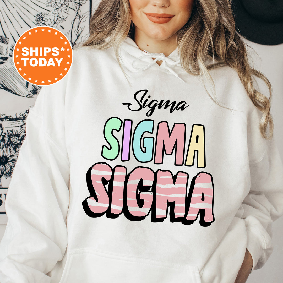 a woman wearing a white sweatshirt that says stigmaa stigmaa