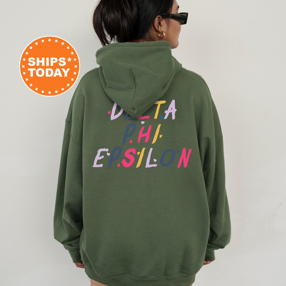 a woman wearing a green hoodie with the words delta esslon printed on