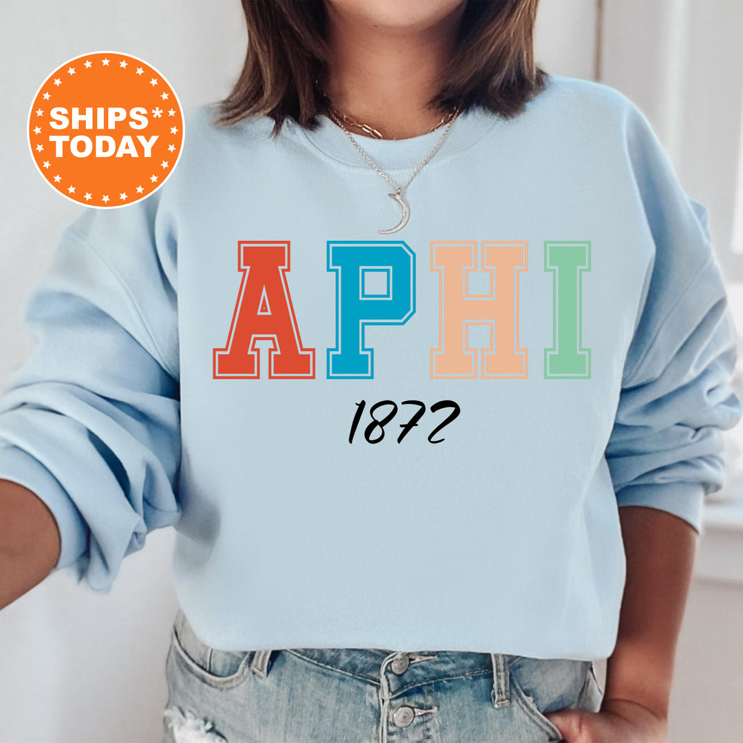 a woman wearing a sweatshirt with the word aphil printed on it