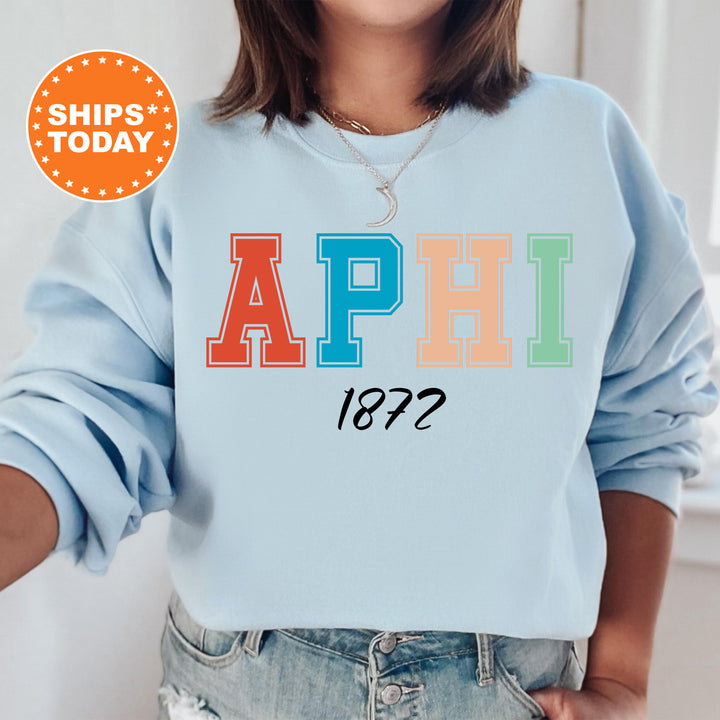 a woman wearing a sweatshirt with the word aphil printed on it