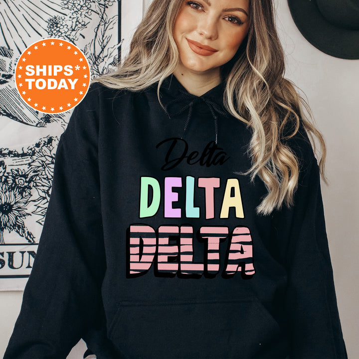 a woman wearing a black delta delta hoodie