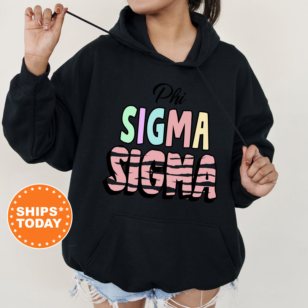 a woman wearing a black hoodie with the word stigma on it