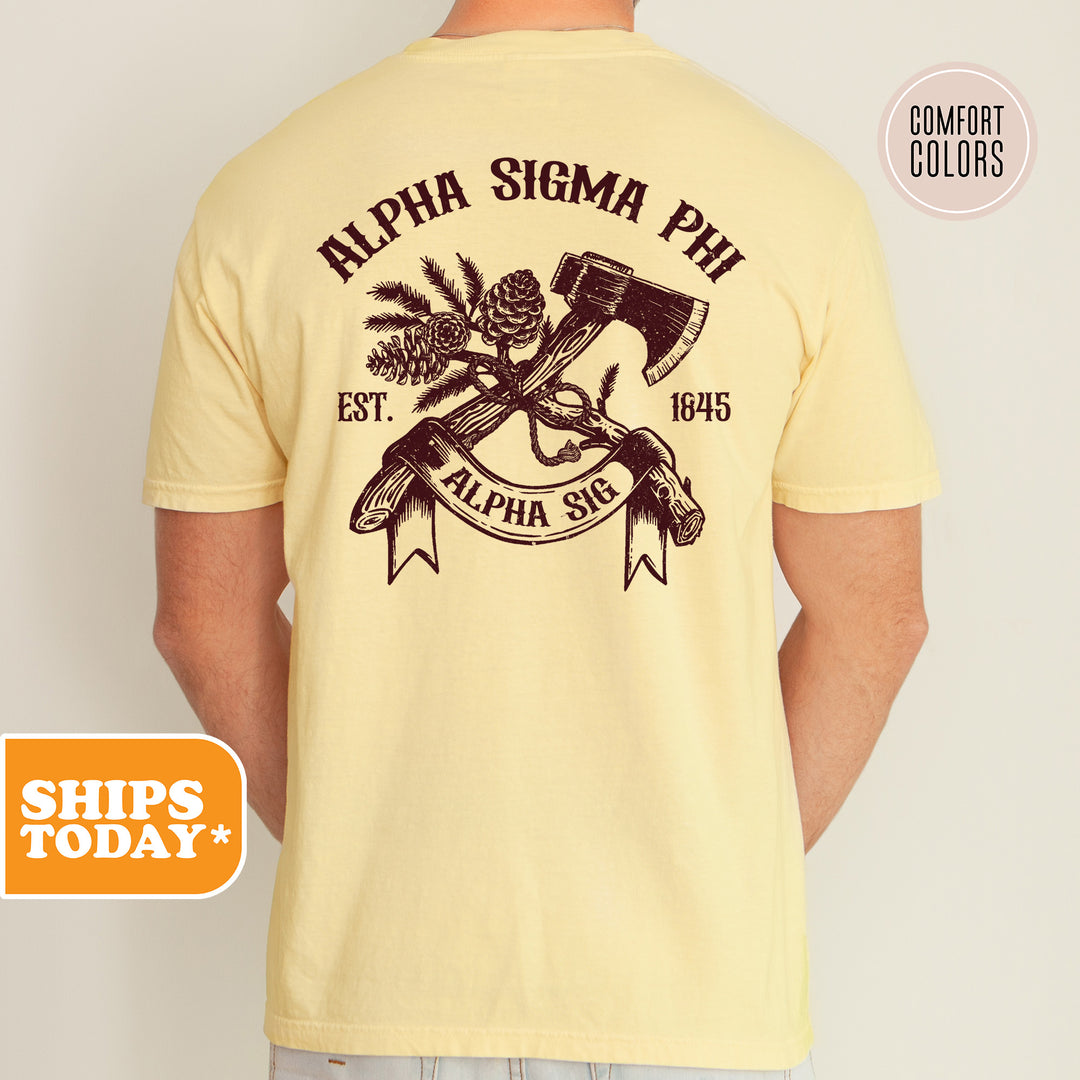 a man wearing a yellow shirt with an image of a hammer and pine cones on