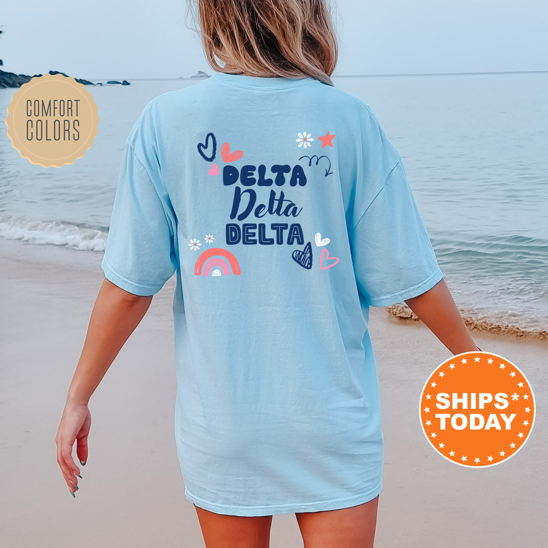 a woman walking on the beach in a blue shirt