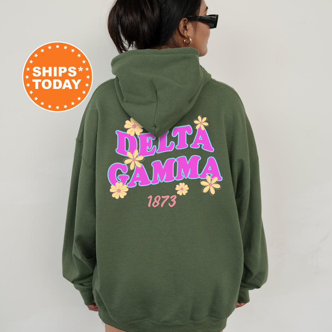 A person wearing a green hoodie with the Delta Gamma sorority logo and the year 1873 printed on it.
