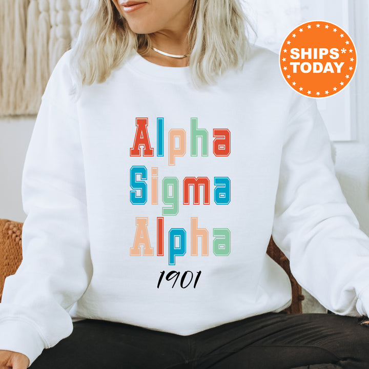 a woman sitting on a chair wearing a white sweatshirt