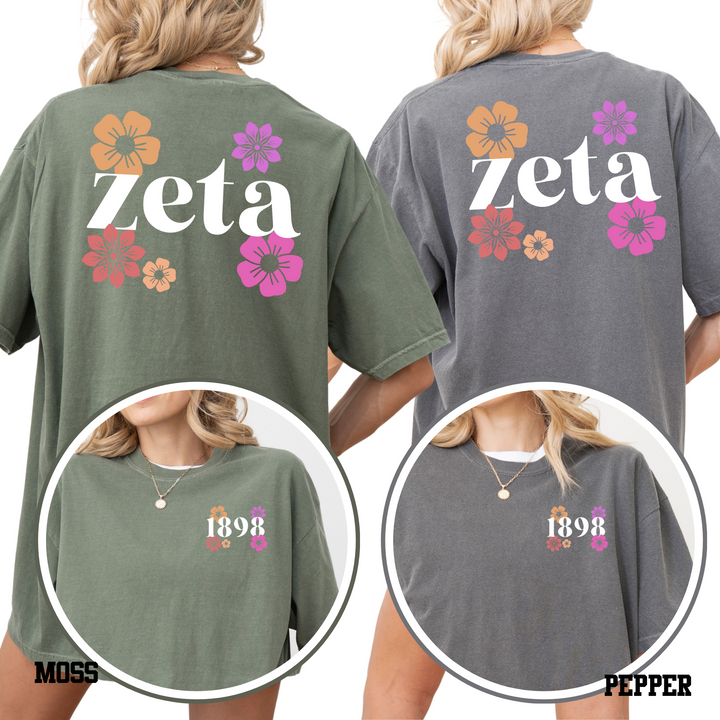 two women wearing t-shirts with the word "Zeta" printed on them.