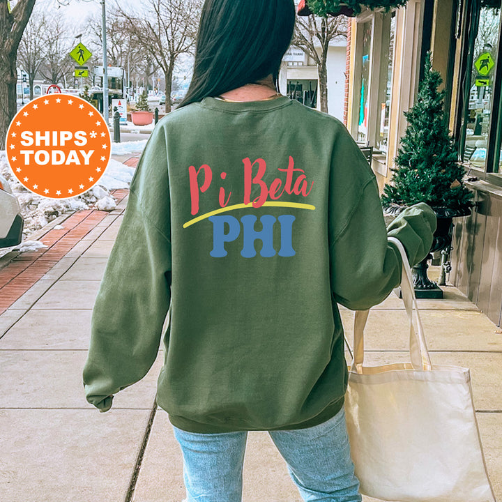 A person wearing a green sweatshirt with the text "Pi Beta Phi" printed on it, walking on a sidewalk.
