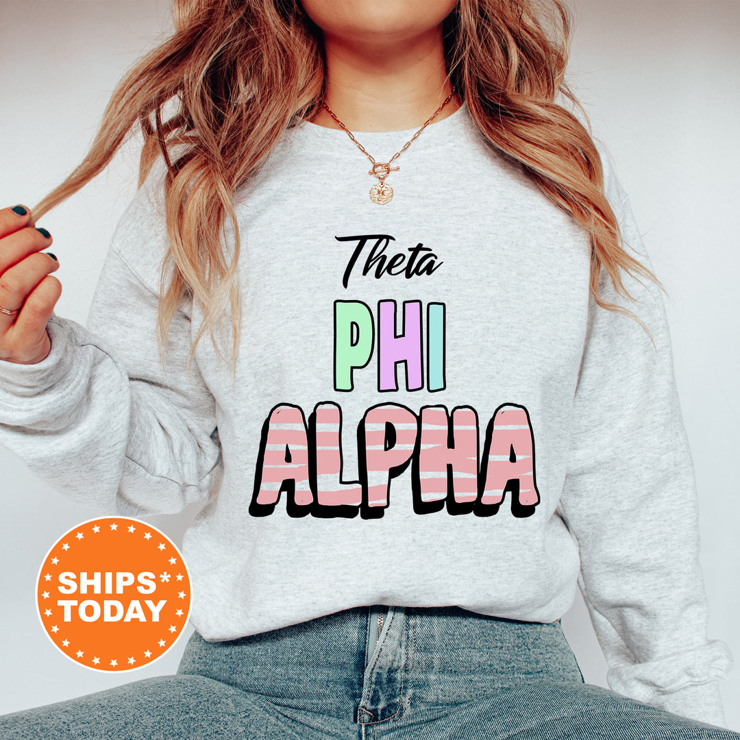 a woman wearing a sweatshirt that says the phi alpha