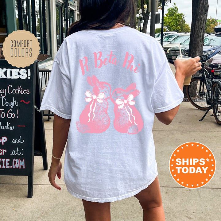 a woman walking down a sidewalk while wearing a t - shirt
