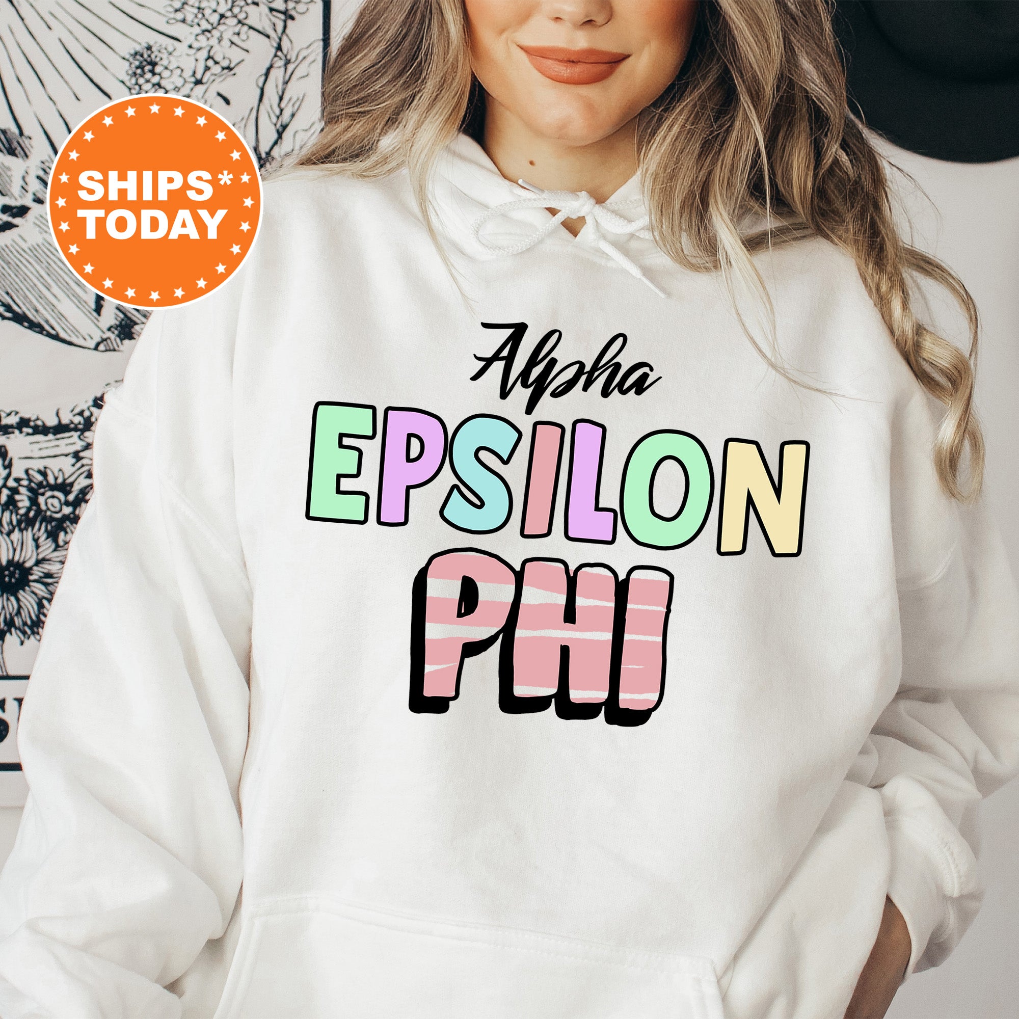 a woman wearing a white hoodie with the words epiloon phi on it