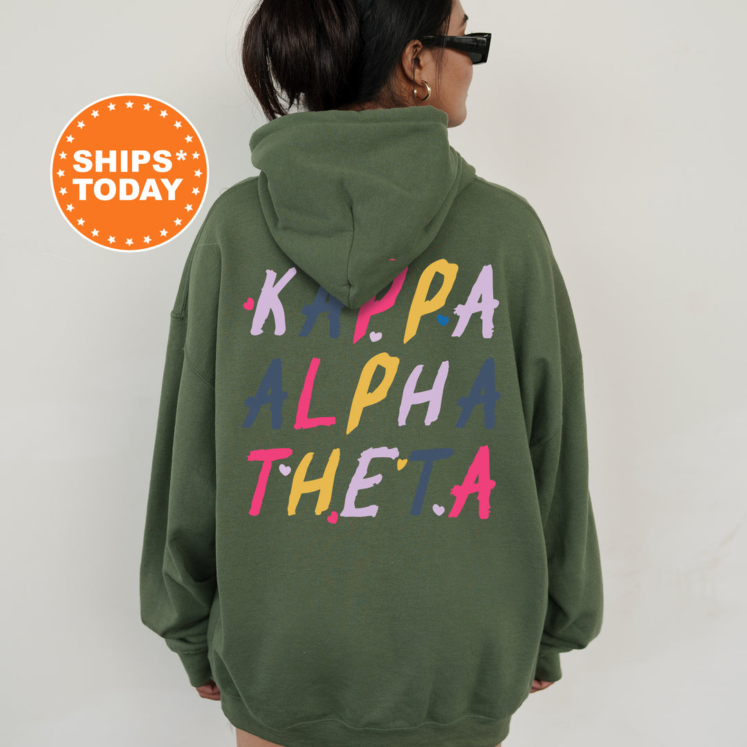 a woman wearing a green hoodie with the words klippa alphabet on it