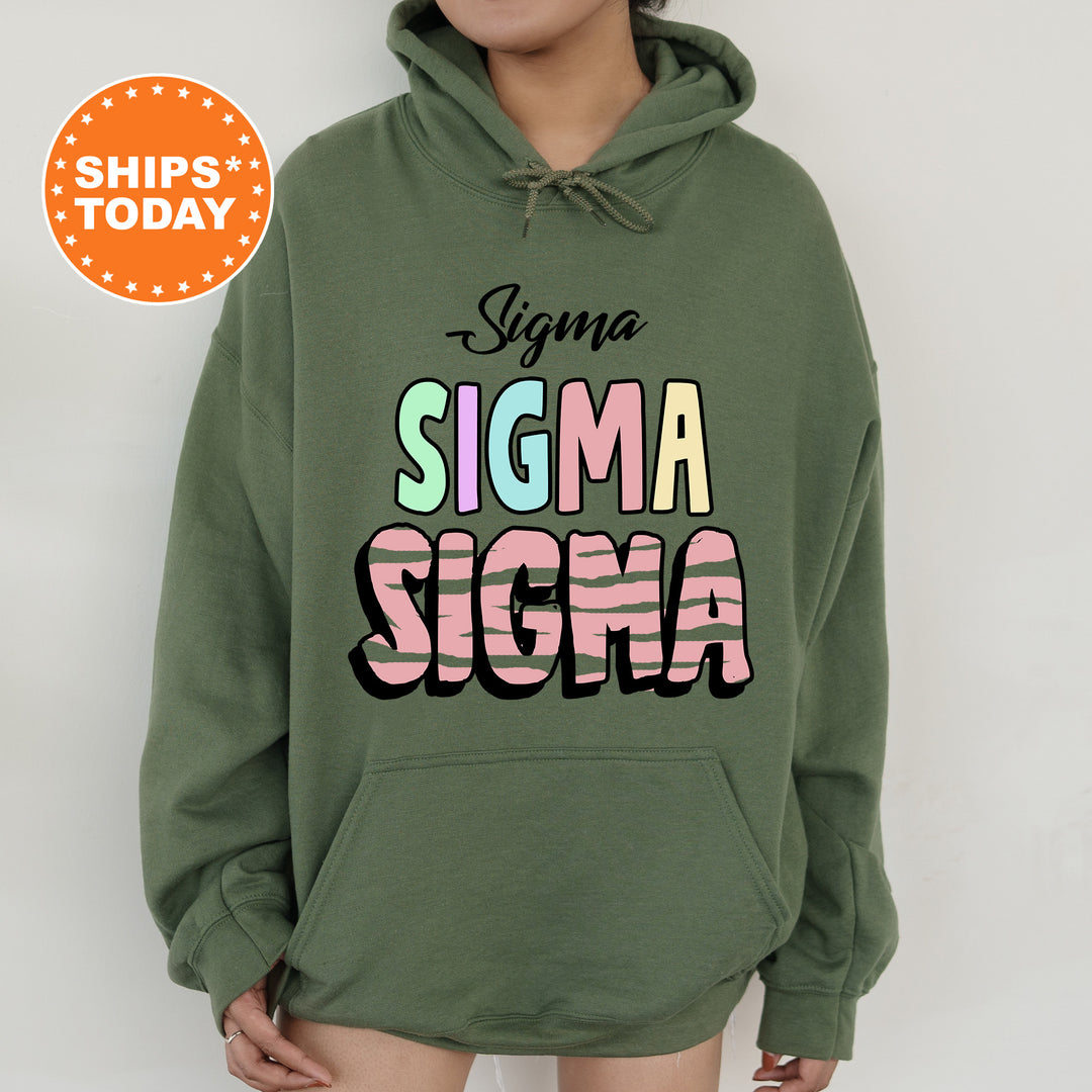 a woman wearing a green hoodie that says stigmaa stigmaa