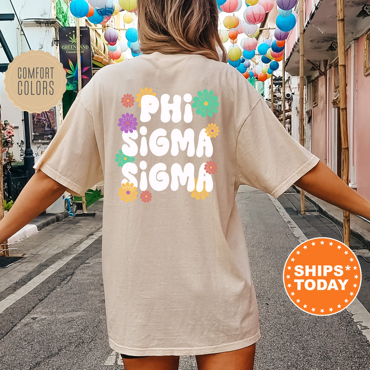 a woman wearing a phi sigma shirt walking down a street
