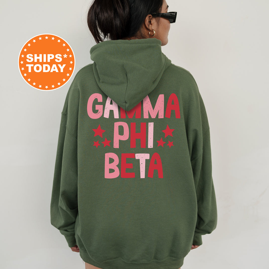 a woman wearing a green hoodie that says garma phi beta