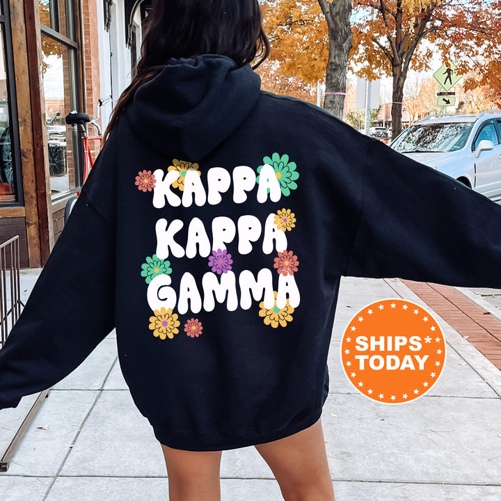 a woman in a black hoodie that says kapp kapp gama