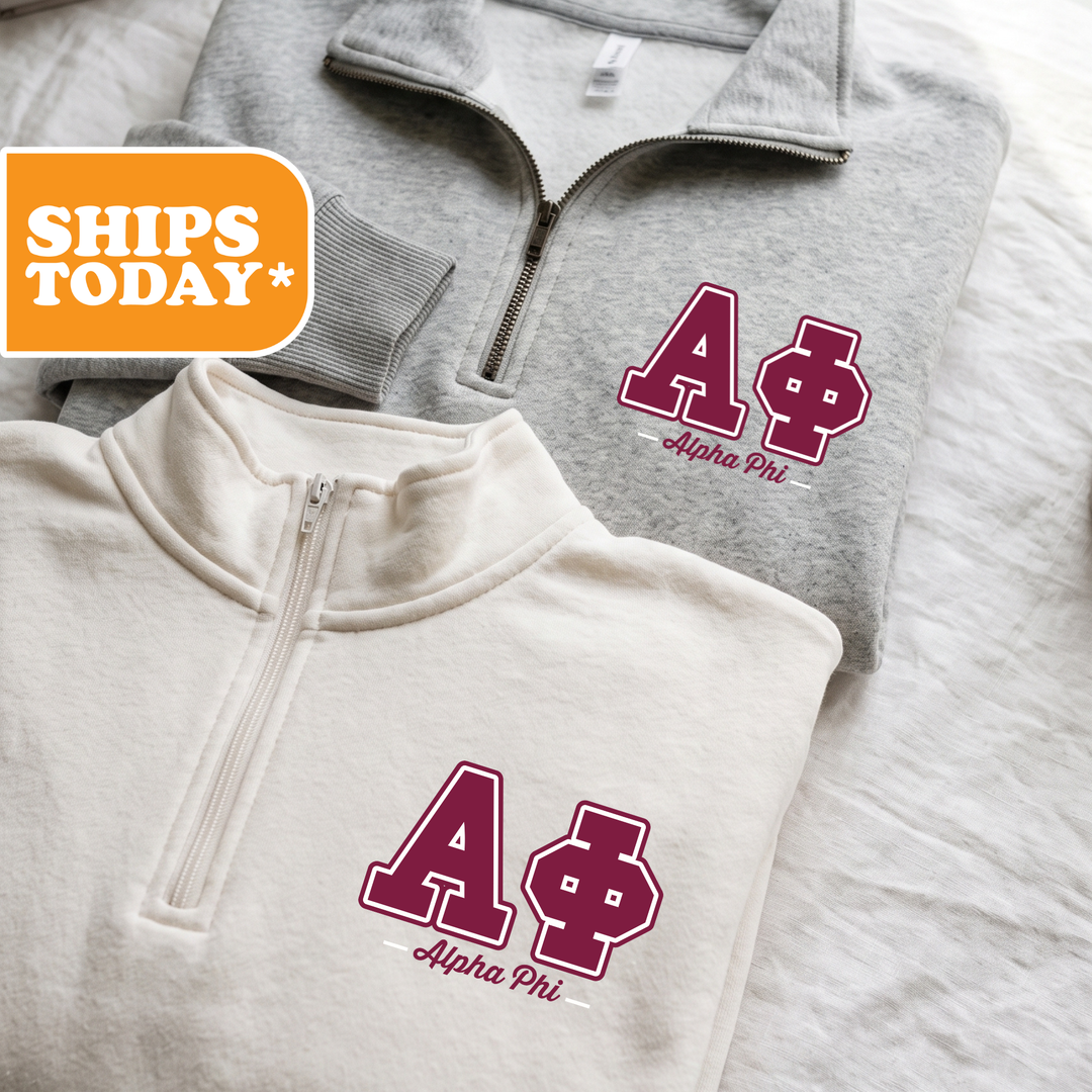 Two gray sweatshirts with the letters "A" and "Phi" printed on them, along with the text "Alpha Phi" below the letters.