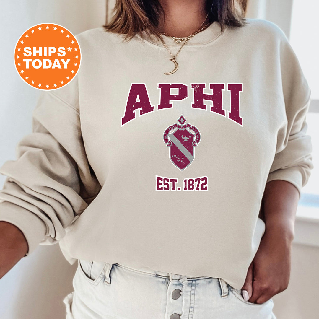 a woman wearing a sweatshirt with the words aphi on it