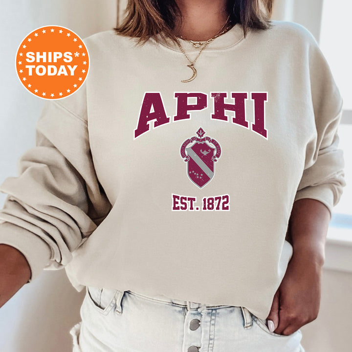 a woman wearing a sweatshirt with the words aphi on it