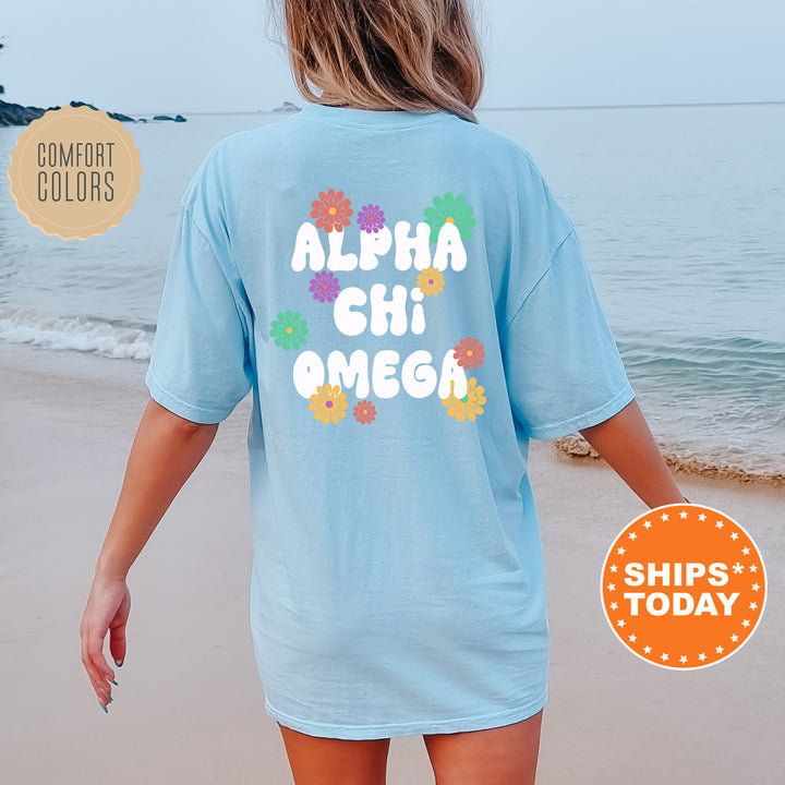 a woman walking on the beach wearing a blue shirt that says aloha chi