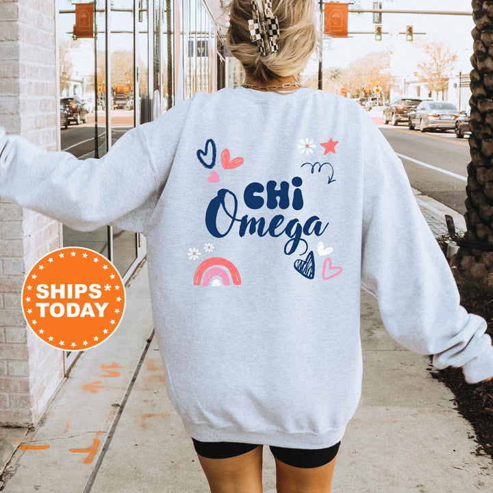 a woman walking down a sidewalk wearing a sweatshirt