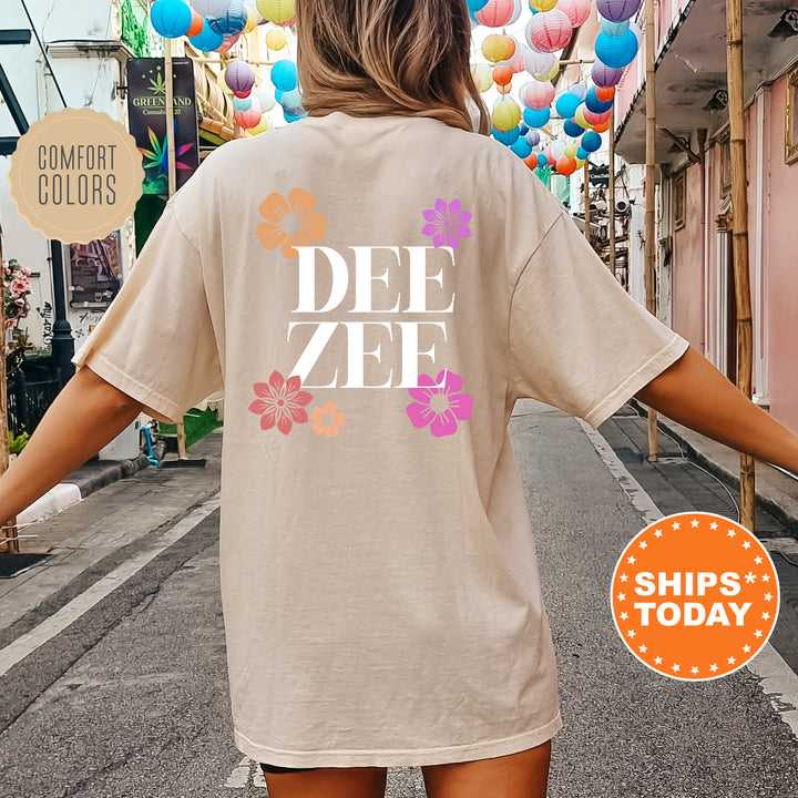 a woman walking down a street with a t - shirt saying dee zee