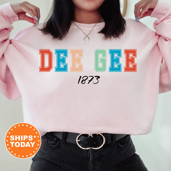 a woman wearing a pink sweatshirt with the word dee gee printed on it