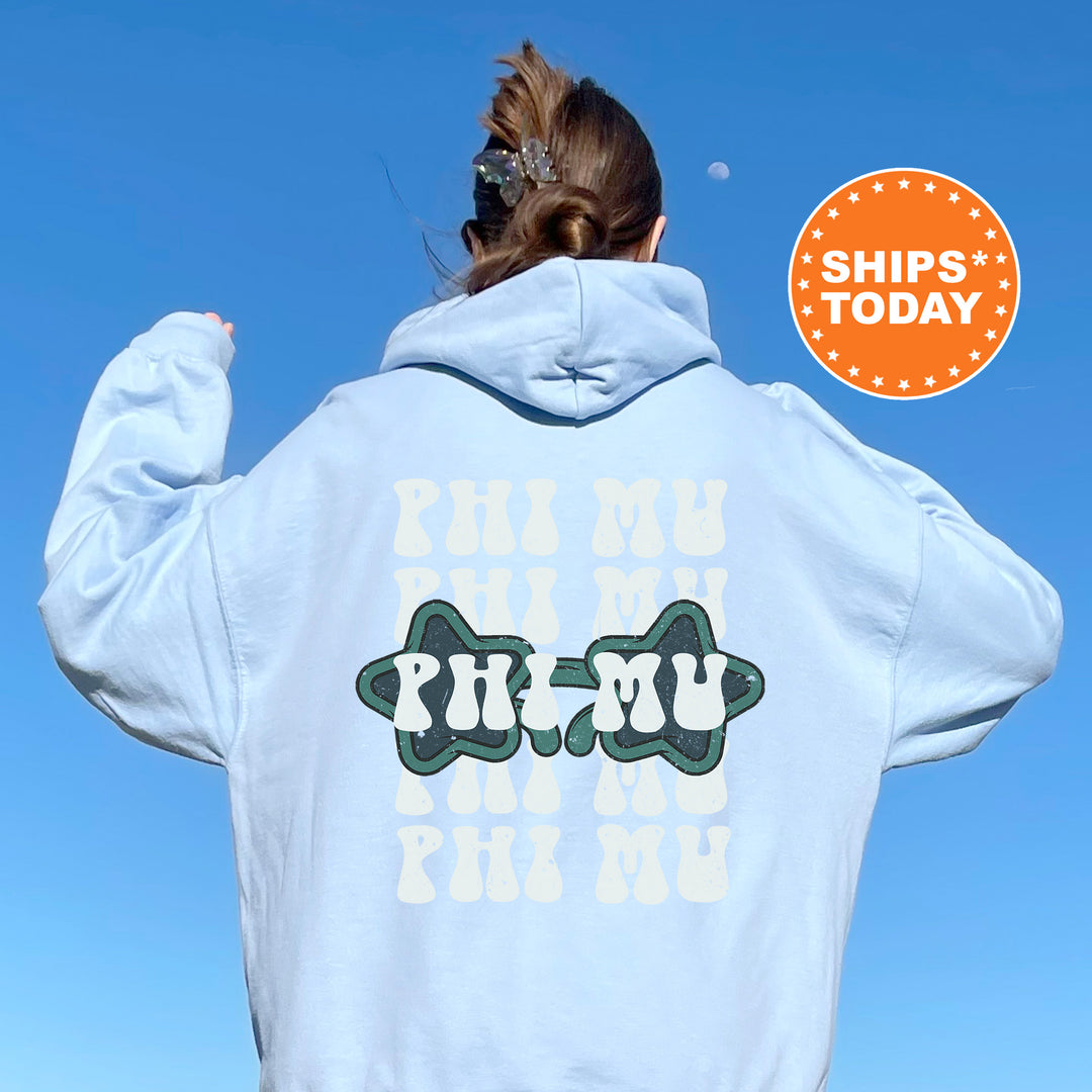 a woman with her back to the camera wearing a white hoodie