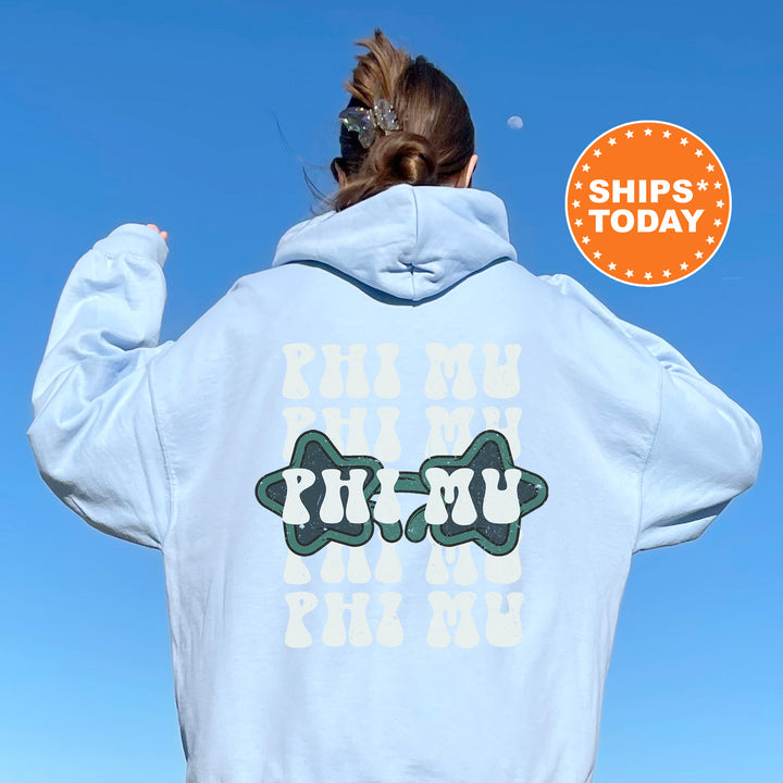a woman with her back to the camera wearing a white hoodie