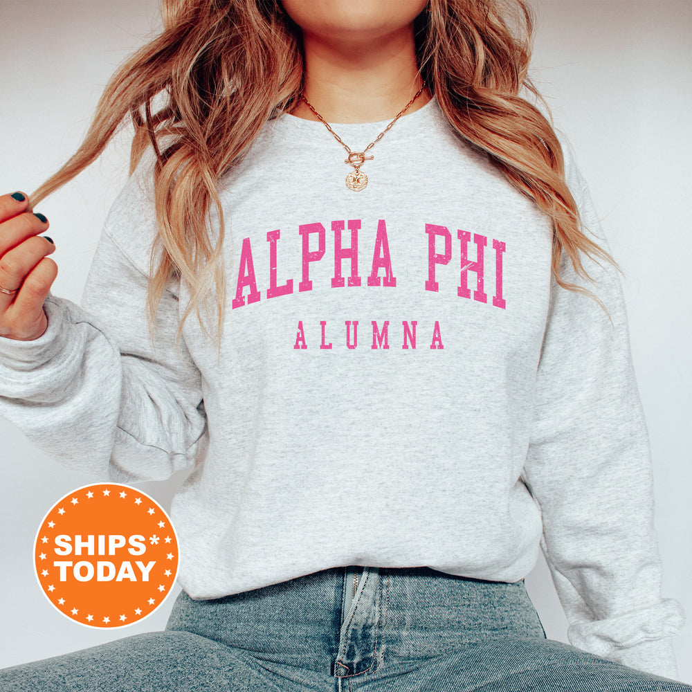 a woman wearing a sweatshirt with the words alpha phi on it