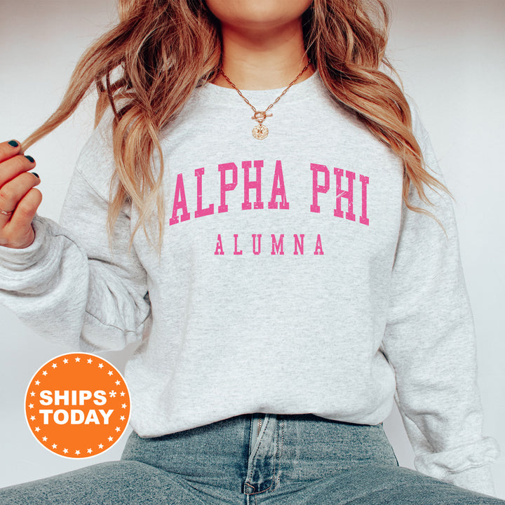 a woman wearing a sweatshirt with the words alpha phi on it