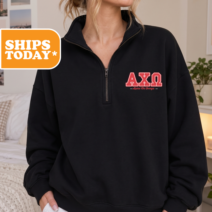 A person wearing a black sweatshirt with the letters 'AXQ' printed on it.