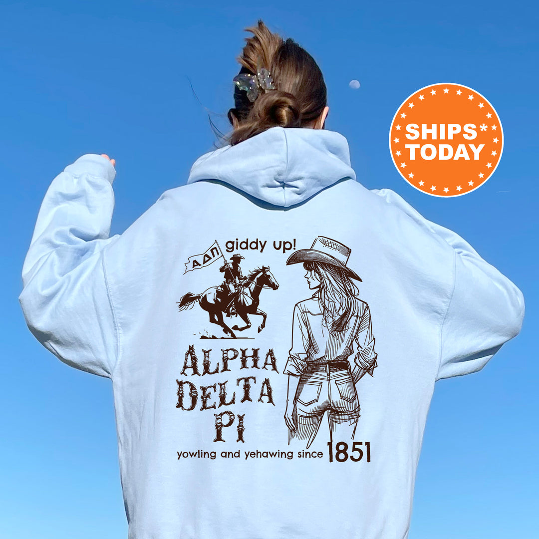 a woman wearing a white hoodie with a horse on it