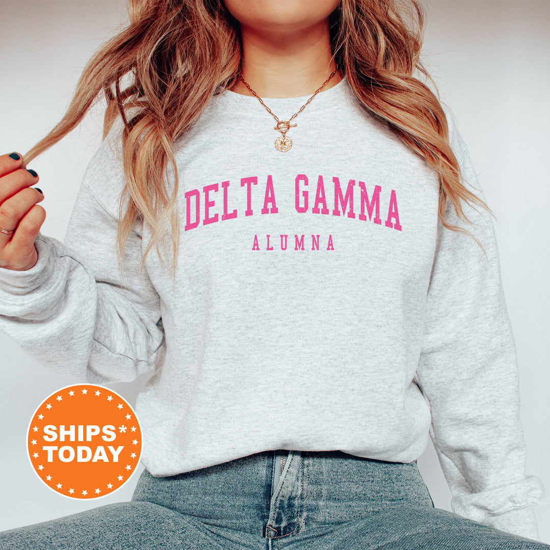 a woman wearing a sweatshirt that says delta gamma