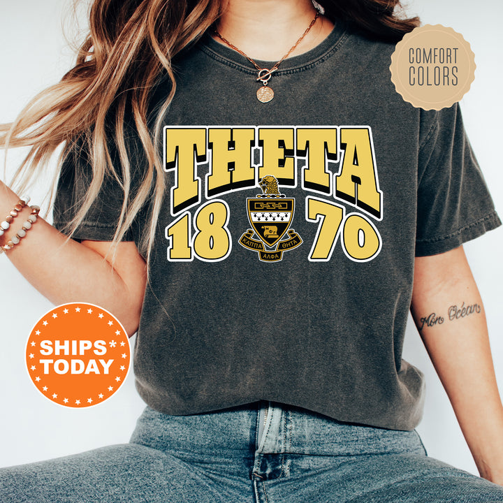 a woman wearing a t - shirt that says thea in yellow and black
