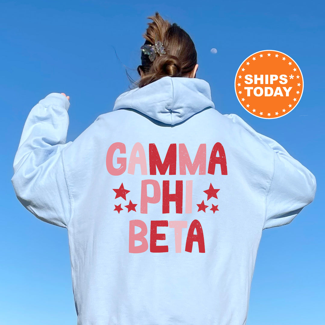 a woman wearing a white hoodie that says garma phi beta