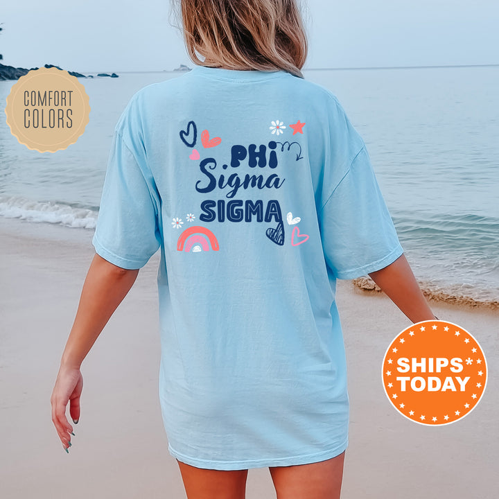 a woman walking on the beach wearing a blue shirt