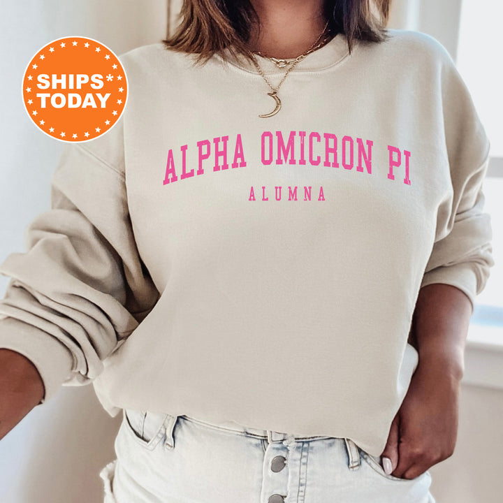 a woman wearing a sweatshirt that says, alpha omigoon pi