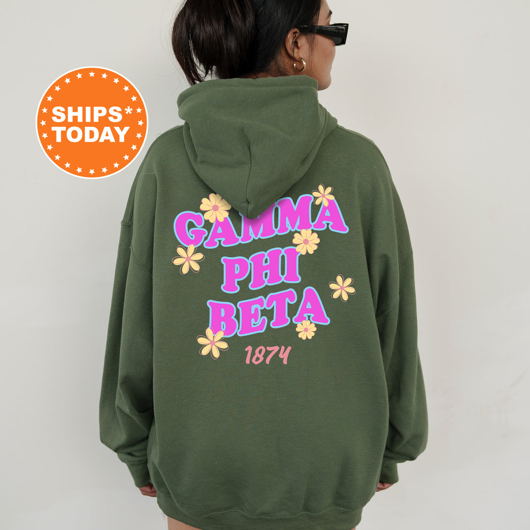 A person wearing a green hoodie with the text "Gamma Phi Beta 1874" printed on it.
