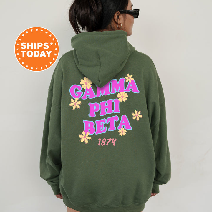 A person wearing a green hoodie with the text "Gamma Phi Beta 1874" printed on it.
