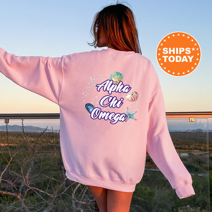 a woman wearing a pink sweatshirt with the words aloha chi chi chi chi