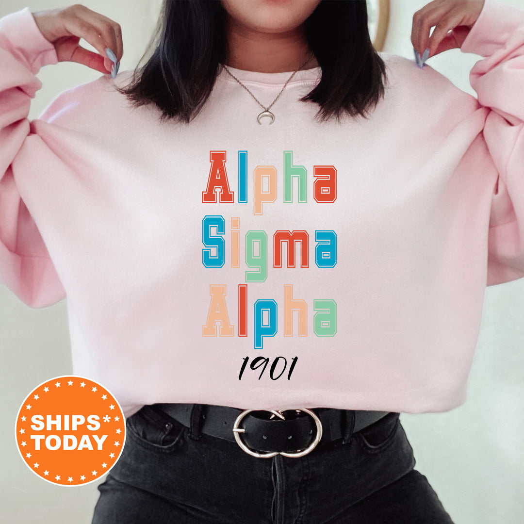 a woman wearing a pink sweatshirt with the word aloha on it