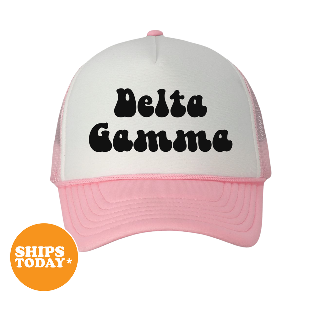 A white and pink trucker hat with the text "Delta Gamma" printed on it.
