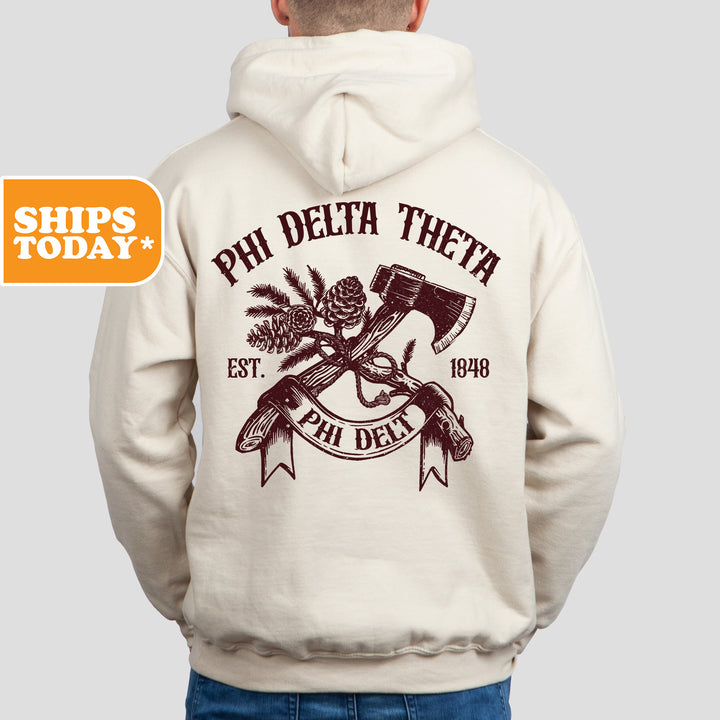 a man wearing a white phi delta hoodie
