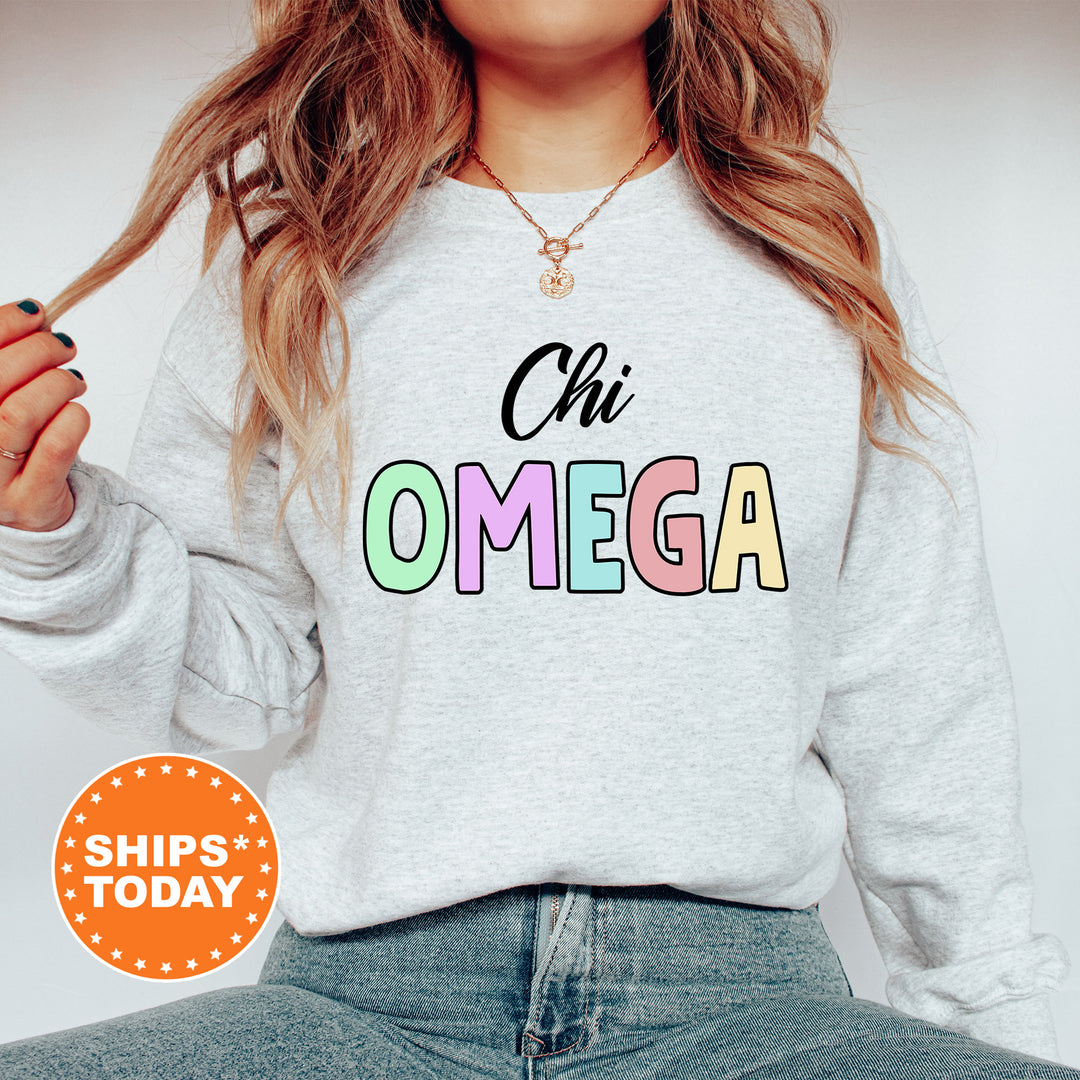 a woman wearing a sweatshirt that says chi omega